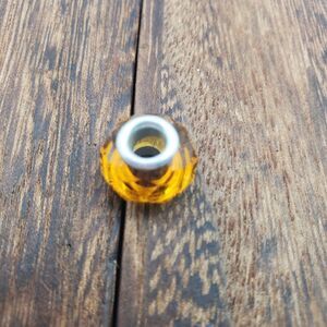 Amber yellow crystallized charm